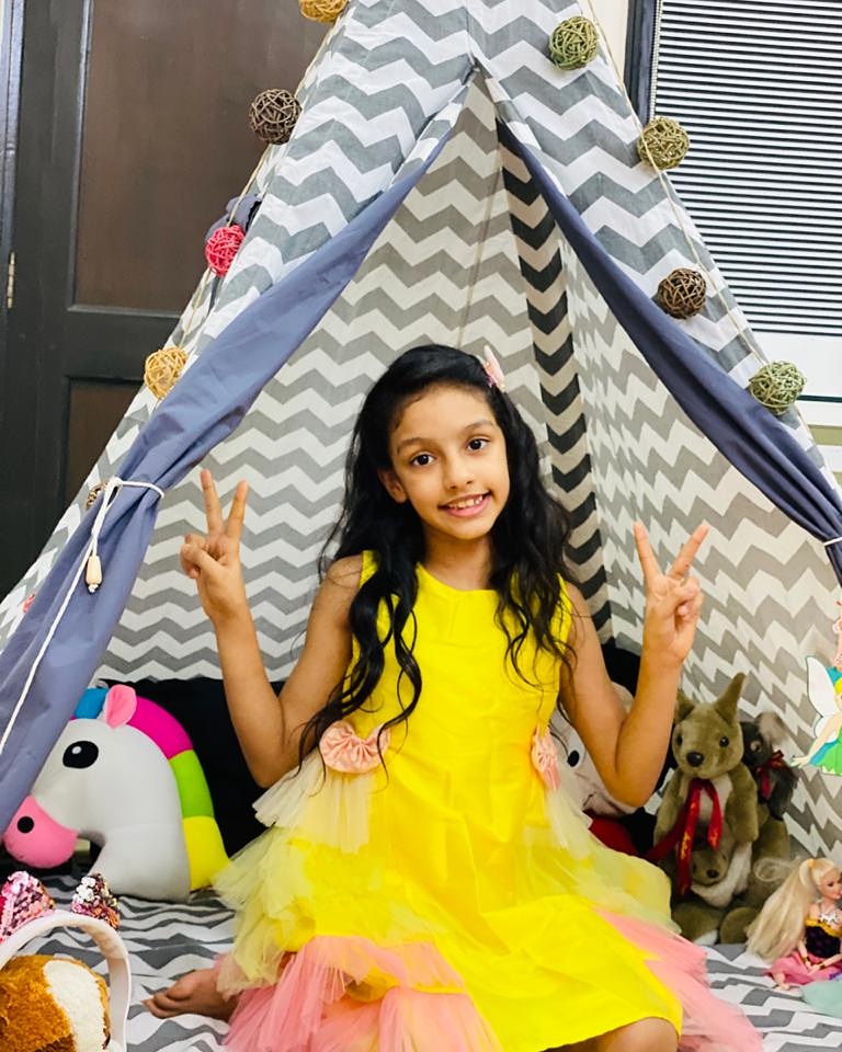 camping in a teepee tent is an exciting slumber party idea for kids
