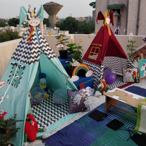 2 teepee tents set up on a terrace for kids slumber party